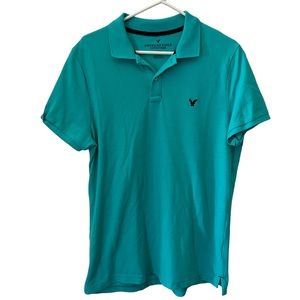MENS GOLF POLO SHIRT SIZE L TEAL W/ NAVY BLUE ACCENTS AMERICAN EAGLE OUT…